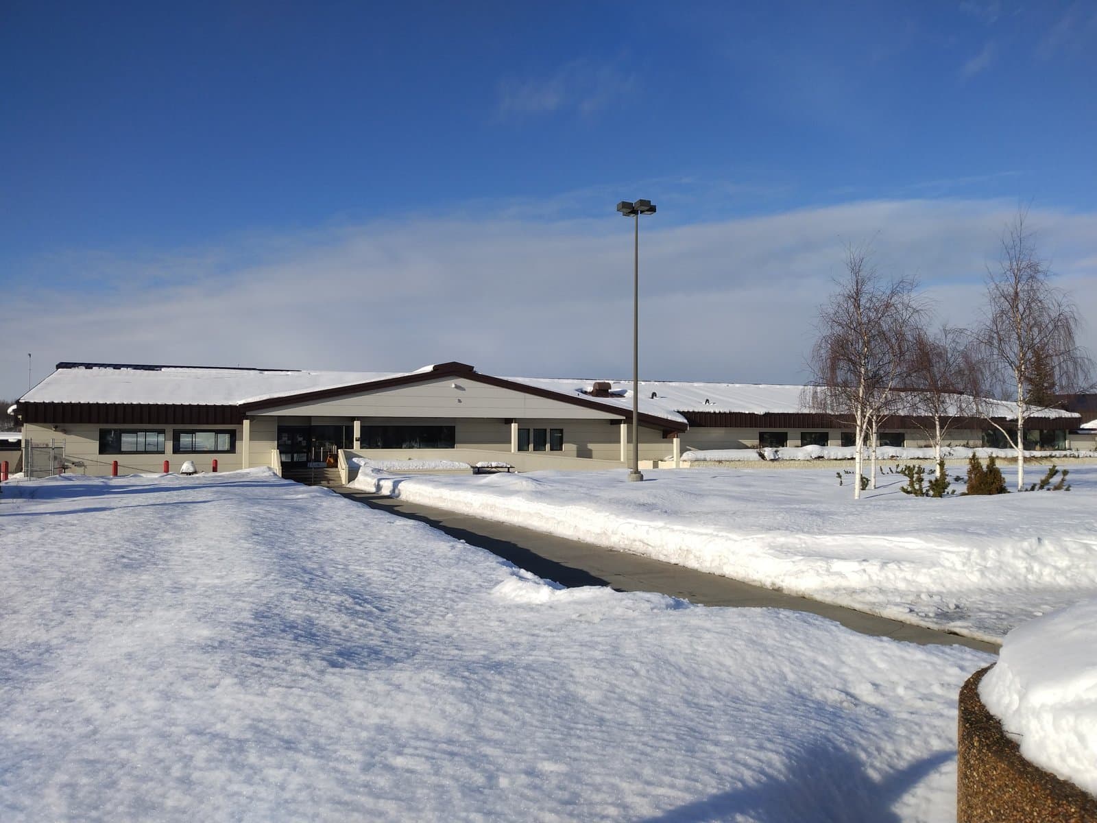 AMC passenger terminal at Joint Base Elmendorf-Richardson, Alaska, in winter snow.