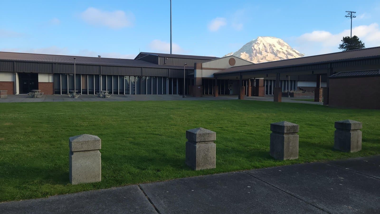 AMC passenger terminal at Joint Base Lewis-McChord (McChord Field), Washington, with Mount Rainier behind it.
