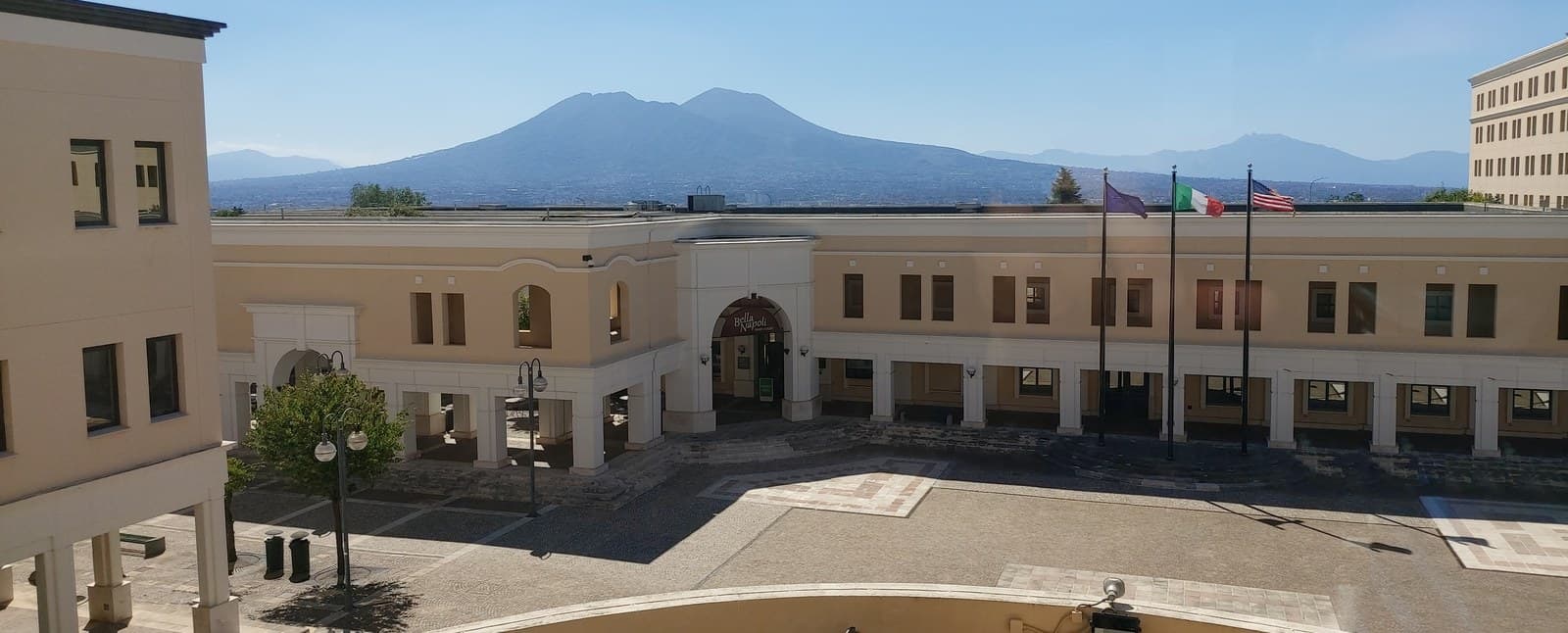 A Naval Support Activity Naples building, with Mount Vesuvius in the background.